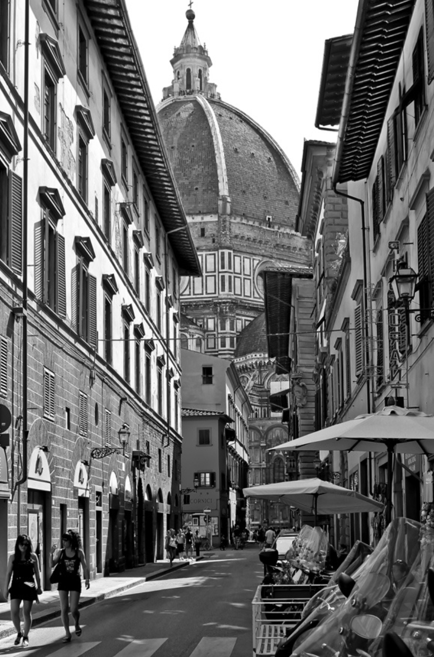 Beautiful image of the Duomo in Florence, Italy from a humble alleyway.